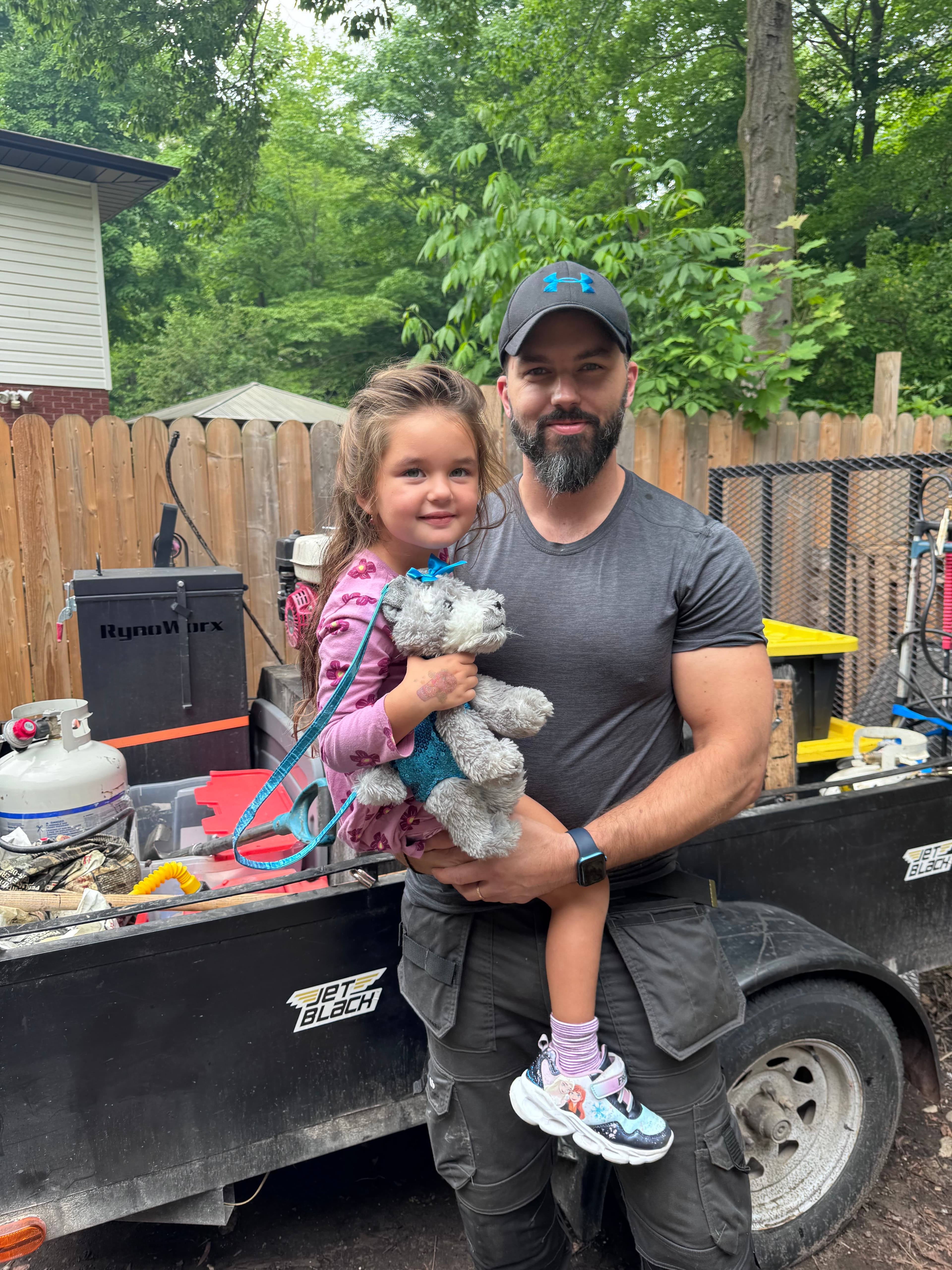 Josh with his daughter at a job site